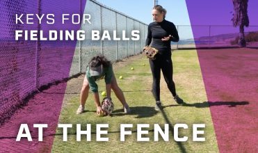 fielding balls at the fence